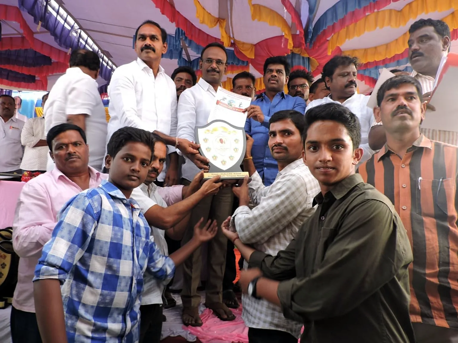 Blue Moon students receiving shield and certificate at prize ceremony
