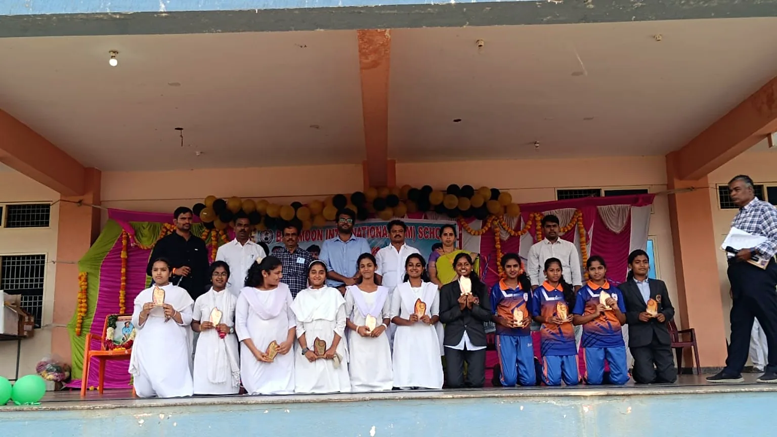 Blue Moon girls with stage prize trophies