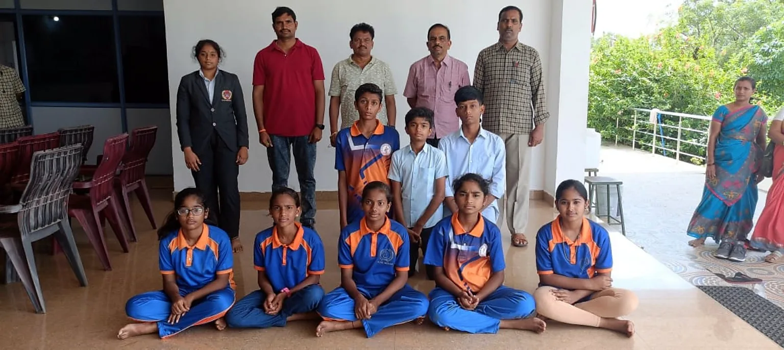 Blue Moon students in sports uniforms with staff